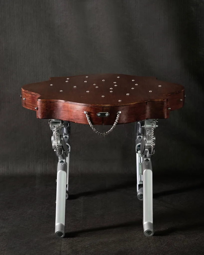 19th-century coffee table gets articulated computer arms to take on a canine form - 1
