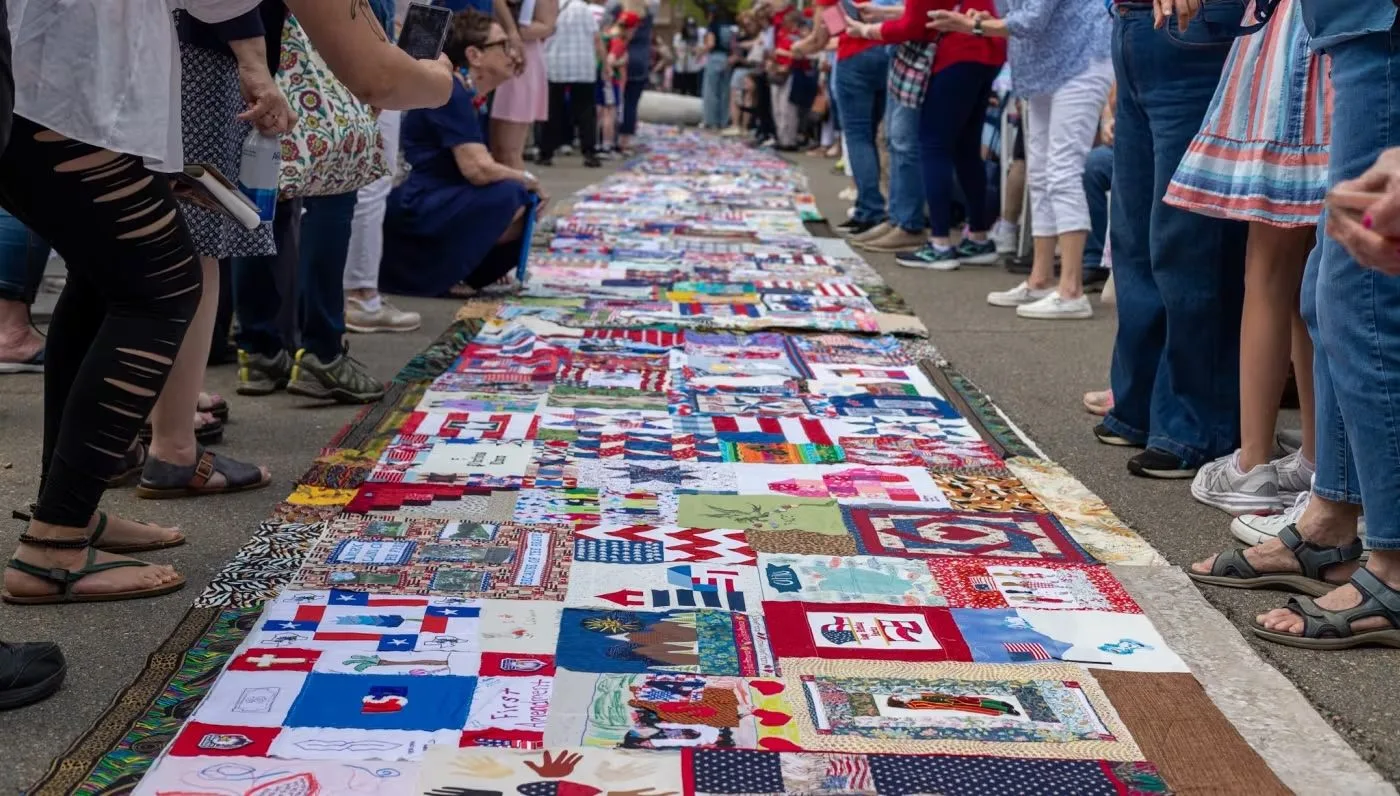 The quilt is a patchwork of American stories.