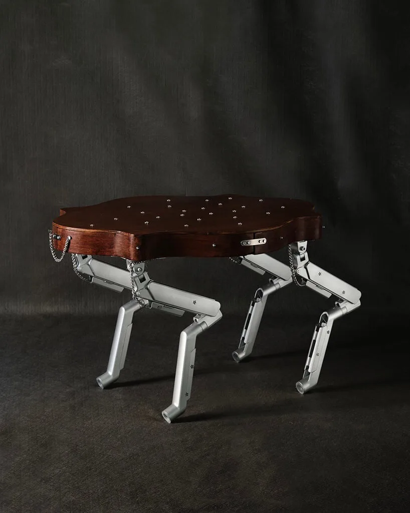 19th-century coffee table gets articulated computer arms to take on a canine form - 2