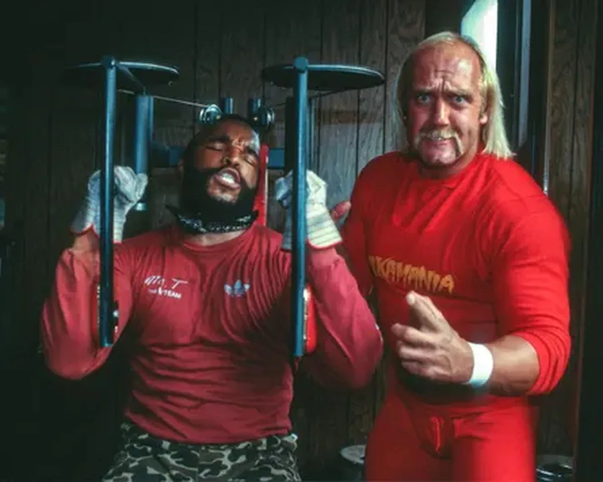 Mr T working out and Hogan poses next to him, dressed in red
