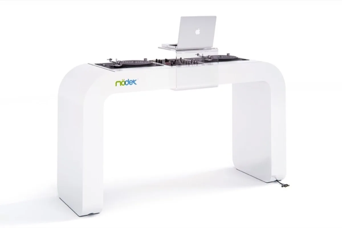continuous white DJ console integrates turntables, mixers, and hidden cables - 1