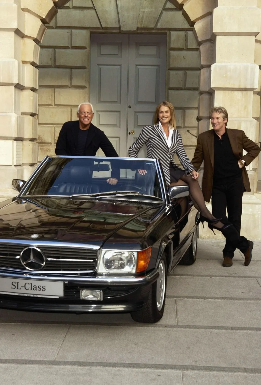 Giorgio Armani Lauren Hutton and Richard Gere with a car
