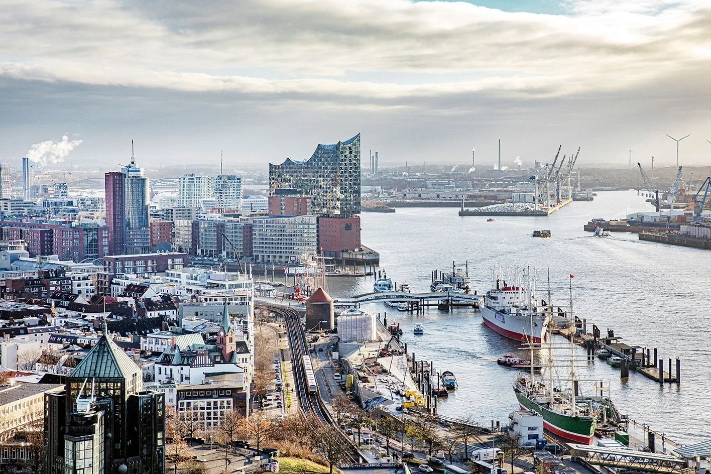 the Elbphilharmonie in Hamburg, by the water on a cloudy day
