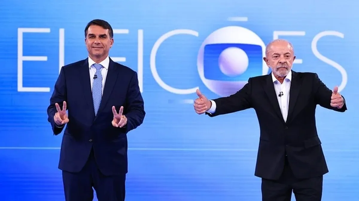 Flavio Bolsonaro, presidential candidate for the Partido Liberal and Luiz Inácio Lula Da Silva, incumbent president of Brazil pose for photographers before a debate 