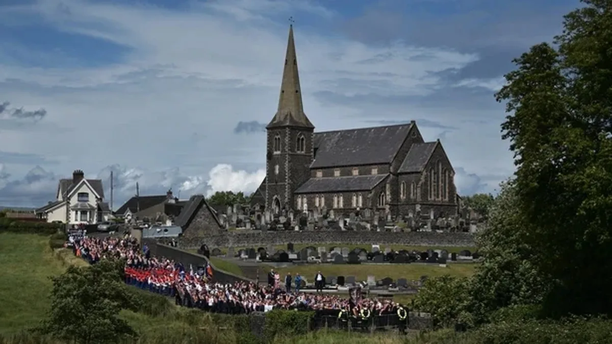 Orangemen stand together as they are blocked from continuing their return march on July 9, 2023 in Portadown, Northern Ireland