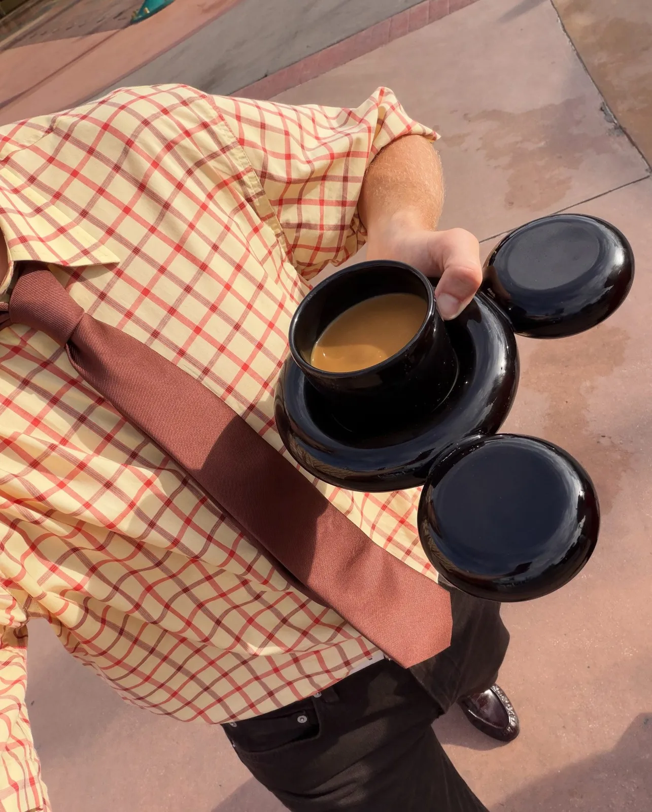 Man holding cup and saucer