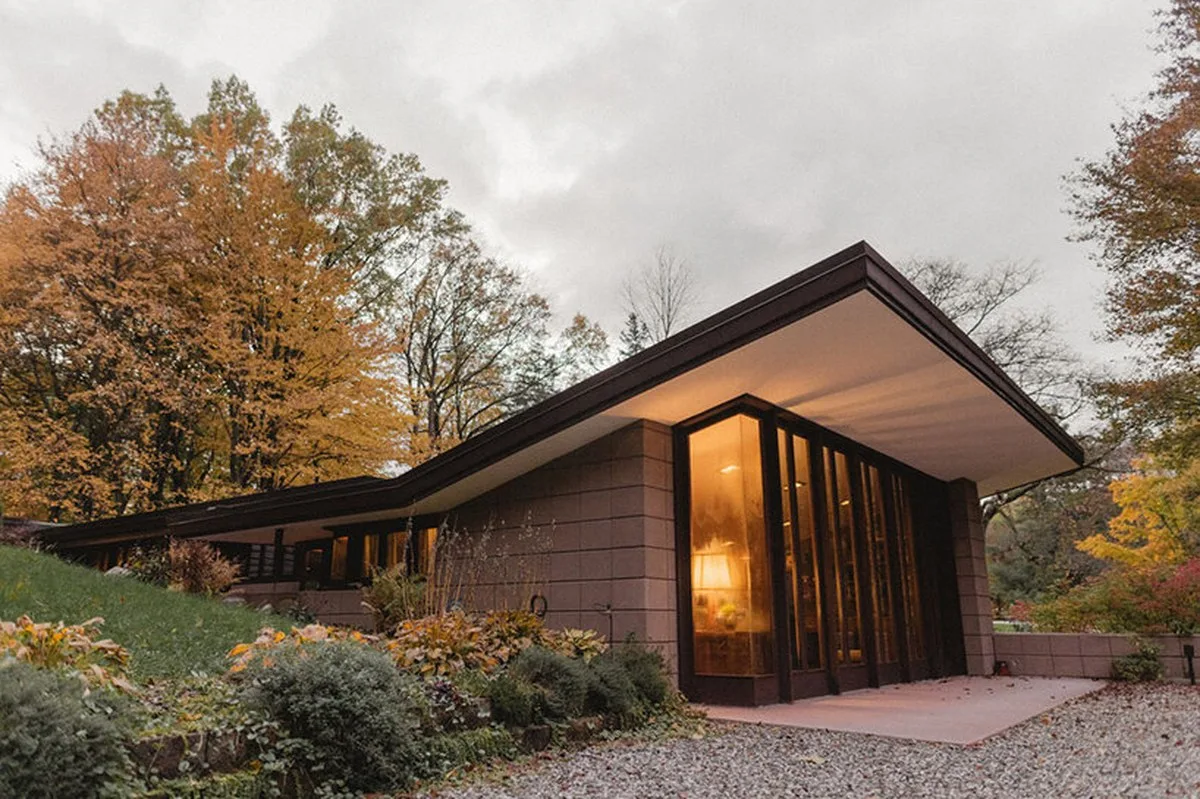 cantilevered roof extends over frank lloyd wright’s concrete usonian house, now listed - 2