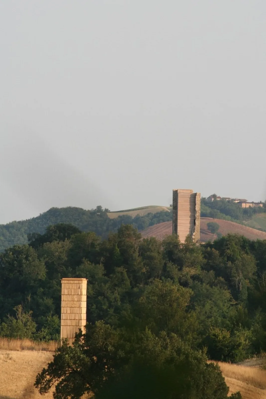 moving shingles envelop timber tower reinterpreting lunano’s stone architecture - 1